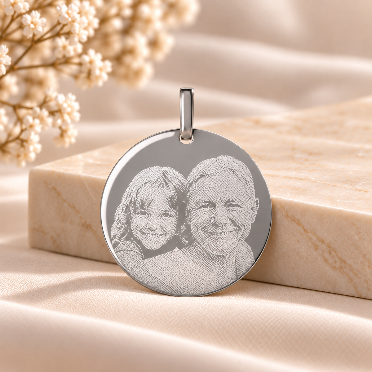 A12 personalised silver round pendant on smooth luxury stone